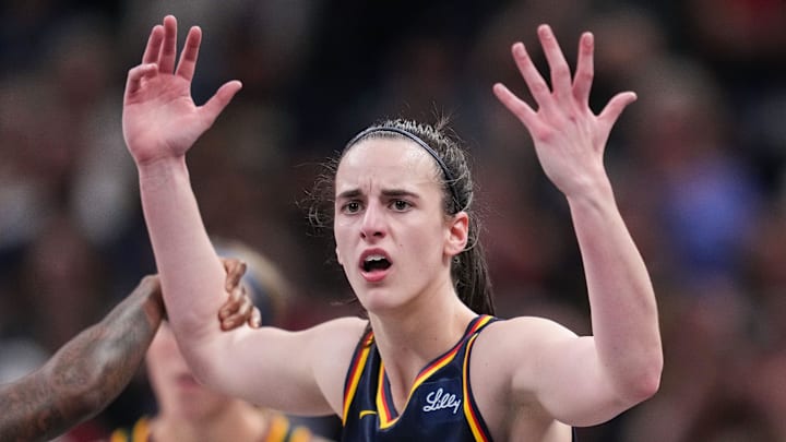 Indiana Fever guard Caitlin Clark (22) throws her hands up to the referee on Sunday, Sept. 15, 2024, during the game at Gainbridge Fieldhouse in Indianapolis. The Indiana Fever defeated the Dallas Wings, 110-109.