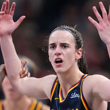 Indiana Fever guard Caitlin Clark (22) throws her hands up to the referee 