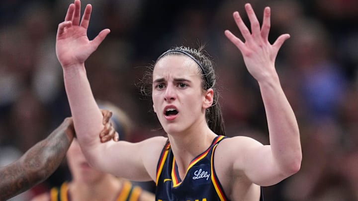 Indiana Fever guard Caitlin Clark (22) throws her hands up to the referee 