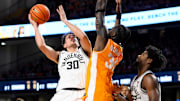 Jan 18, 2025; Nashville, Tennessee, USA;  Vanderbilt Commodores guard Chris Manon (30) shoots over Tennessee Volunteers forward Felix Okpara (34) during the first half at Memorial Gymnasium. 