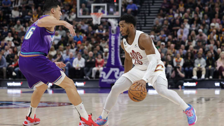 Jan 10, 2023; Salt Lake City, Utah, USA;  Cleveland Cavaliers guard Donovan Mitchell (45) keeps the ball from Utah Jazz forward Simone Fontecchio (16) during the second quarter at Vivint Arena. Mandatory Credit: Chris Nicoll-USA TODAY Sports