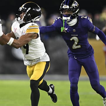 Dec 21, 2024; Baltimore, Maryland, USA;  Pittsburgh Steelers wide receiver Calvin Austin III (19) catches a pass along the sideline in front of Baltimore Ravens cornerback Nate Wiggins (2) during the second half at M&T Bank Stadium. Mandatory Credit: Tommy Gilligan-Imagn Images