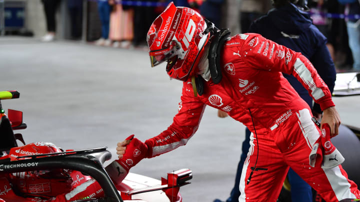 Nov 17, 2023; Las Vegas, Nevada, USA; Scuderia Ferrari driver Charles LeClerc of Monaco (16) greets driver Carlos Sainz Jr. of Spain (55) after both qualify front row at Las Vegas Strip Circuit. Mandatory Credit: Gary A. Vasquez-USA TODAY Sports