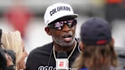Oct 11, 2025; Boulder, Colorado, USA; Colorado Buffaloes head coach Deion Sanders is interviewed by ESPN during a time out in the first quarter against the Iowa State Cyclones at Folsom Field. Mandatory Credit: Ron Chenoy-Imagn Images