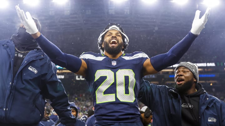 Dec 18, 2023; Seattle, Washington, USA; Seattle Seahawks safety Julian Love (20) celebrates on the bench after his second interception of the fourth quarter against the Philadelphia Eagles at Lumen Field.