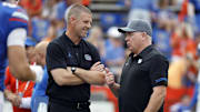 Sep 10, 2022; Gainesville, Florida, USA; Florida Gators head coach Billy Napier and Kentucky Wildcats head coach Mark Stoops greet prior to the game at Ben Hill Griffin Stadium. Mandatory Credit: Kim Klement-Imagn Images