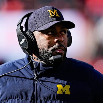 Michigan head coach Sherrone Moore will miss one game next season in addition to two games in 2025 amid the fallout from the Wolverines' sign-stealing controversy.