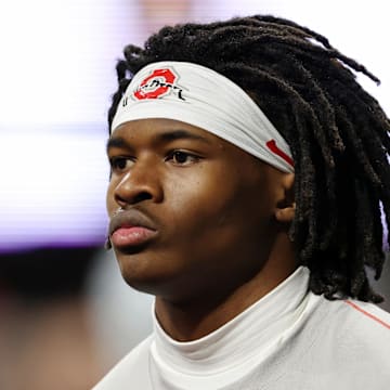 Jan 20, 2025; Atlanta, GA, USA; Ohio State Buckeyes wide receiver Jeremiah Smith (4) warms up before the CFP National Championship college football game at Mercedes-Benz Stadium. Mandatory Credit: Brett Davis-Imagn Images