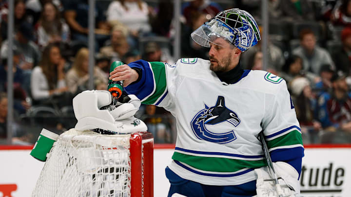 Mar 23, 2022; Denver, Colorado, USA; Vancouver Canucks goaltender Jaroslav Halak (41) sprays water on his blocker before the second period against the Colorado Avalanche at Ball Arena. Mandatory Credit: Isaiah J. Downing-Imagn Images