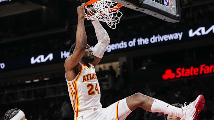 Feb 15, 2023; Atlanta, Georgia, USA; Atlanta Hawks center Bruno Fernando (24) dunks against the New York Knicks during the second half at State Farm Arena. Mandatory Credit: Dale Zanine-Imagn Images