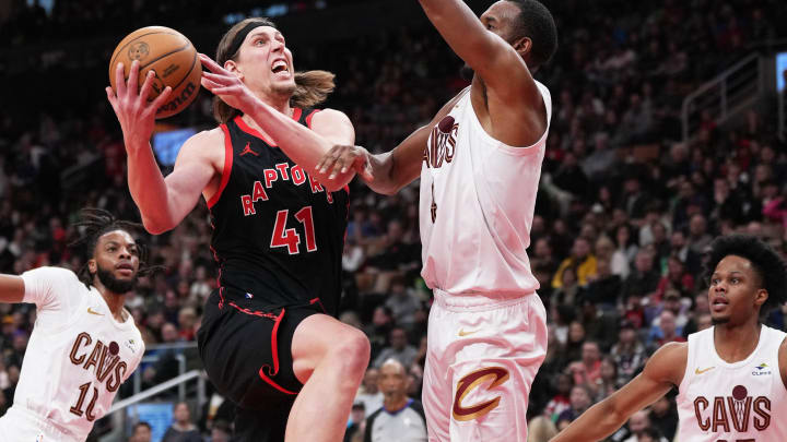 Feb 10, 2024; Toronto, Ontario, CAN; Toronto Raptors forward Kelly Olynyk (41) drives to the basket as Cleveland Cavaliers forward Evan Mobley (4) tries to defend during the third quarter at Scotiabank Arena . Mandatory Credit: Nick Turchiaro-USA TODAY Sports