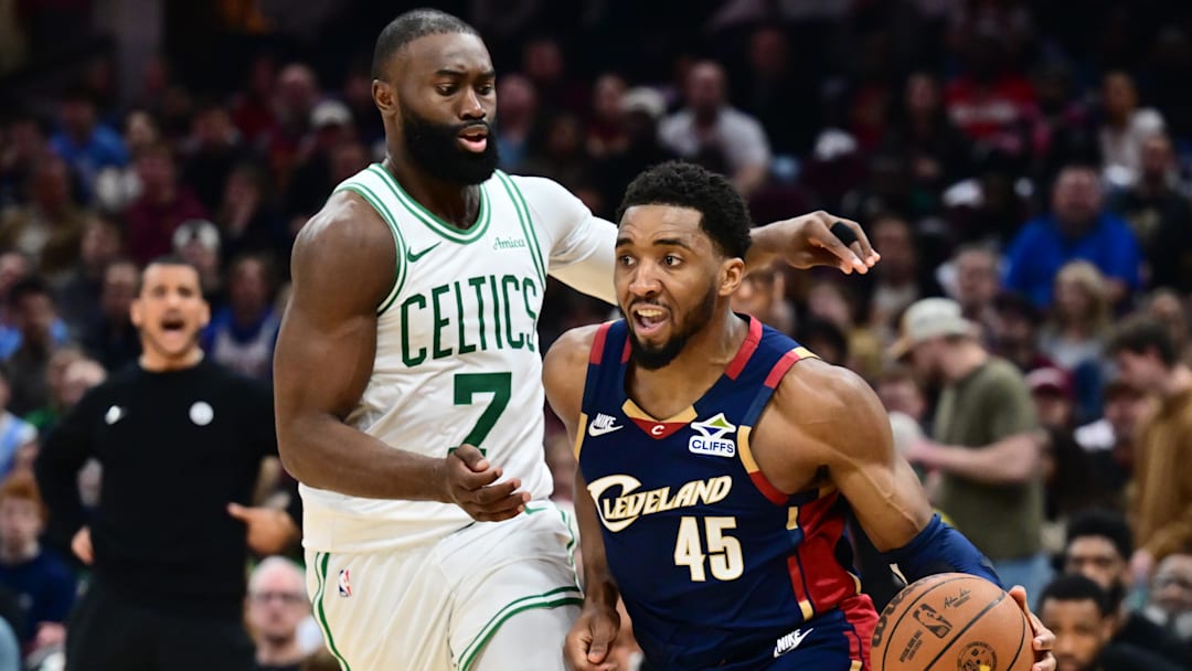 Mar 8, 2026; Cleveland, Ohio, USA; Cleveland Cavaliers guard Donovan Mitchell (45) drives to the basket against Boston Celtics guard Jaylen Brown (7) during the second half at Rocket Arena. Mandatory Credit: Ken Blaze-Imagn Images
