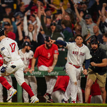 Sep 11, 2024; Boston, Massachusetts, USA; Boston Red Sox left fielder Tyler O'Neill (17) his a three run home run to win the game against the Baltimore Orioles in ten innings at Fenway Park. Mandatory Credit: David Butler II-Imagn Images