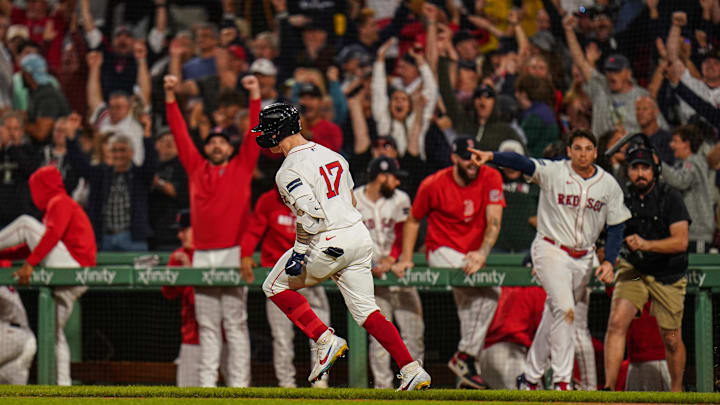 Sep 11, 2024; Boston, Massachusetts, USA; Boston Red Sox left fielder Tyler O'Neill (17) his a three run home run to win the game against the Baltimore Orioles in ten innings at Fenway Park. Mandatory Credit: David Butler II-Imagn Images