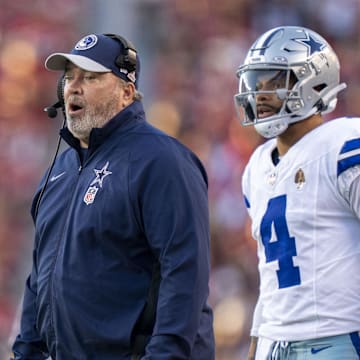 October 8, 2023; Santa Clara, California, USA; Dallas Cowboys head coach Mike McCarthy (left) and quarterback Dak Prescott (4) watch against the San Francisco 49ers during the first quarter at Levi's Stadium. Mandatory Credit: Kyle Terada-Imagn Images