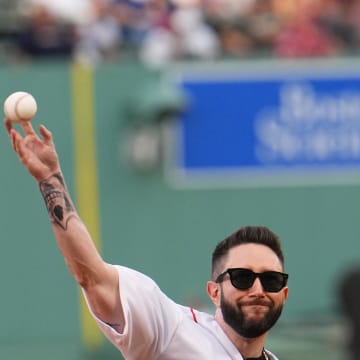Jared Carrabis from Draftkings throws out the first pitch prior to the game between the New York Yankees and Boston Red Sox at Fenway Park in 2022.
