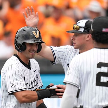 Vanderbilt infielder Mike Mancini (5) celebrates after scoring a run during a NCAA baseball game between the Tennessee Volunteers and Vanderbilt Commodores at Lindsey Nelson Stadium on May 11, 2025.