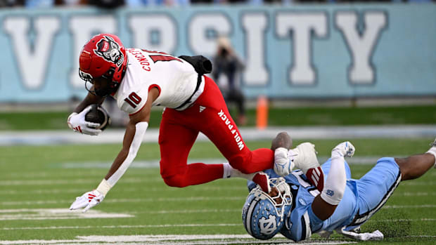 North Carolina State Wolfpack wide receiver Kevin Concepcion tackled North Carolina Tar Heels linebacker Amare Campbell 