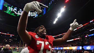 Dec 7, 2024; Atlanta, GA, USA; Georgia Bulldogs offensive lineman Xavier Truss (73) reacts after defeating the Texas Longhorns in overtime in the 2024 SEC Championship game at Mercedes-Benz Stadium. Mandatory Credit: Brett Davis-Imagn Images