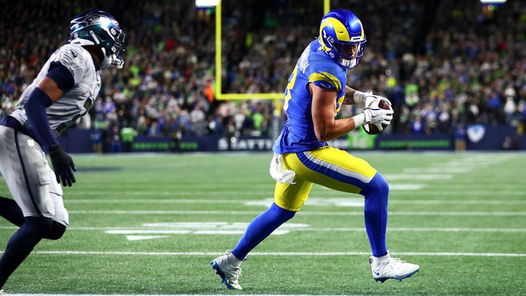 Dec 18, 2025; Seattle, Washington, USA; Los Angeles Rams tight end Terrance Ferguson (18) runs to score a touchdown against Seattle Seahawks safety Nick Emmanwori (3) in the first half at Lumen Field. Mandatory Credit: Kevin Ng-Imagn Images
