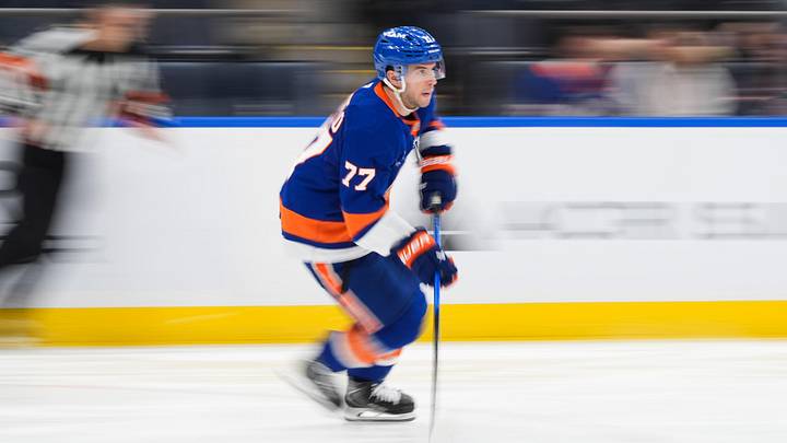 Apr 11, 2026; Elmont, New York, USA; New York Islanders defenseman Tony DeAngelo (77) carries the puck in the third period against the Ottawa Senators at UBS Arena. Mandatory Credit: Alexander Wohl-Imagn Images