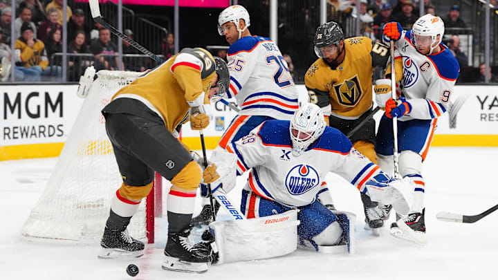 Mar 8, 2026; Las Vegas, Nevada, USA; Edmonton Oilers goaltender Connor Ingram (39) defends his net as Vegas Golden Knights left wing Ivan Barbashev (49) looks for the rebound during the first period at T-Mobile Arena. Mandatory Credit: Stephen R. Sylvanie-Imagn Images