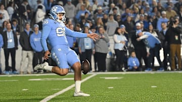 Nov 16, 2024; Chapel Hill, North Carolina, USA; North Carolina Tar Heels punter Tom Maginness (96) punts in the first quarter at Kenan Memorial Stadium. Mandatory Credit: Bob Donnan-Imagn Images