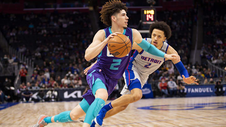 Feb 11, 2022; Detroit, Michigan, USA; Charlotte Hornets guard LaMelo Ball (2) gets defended by Detroit Pistons guard Cade Cunningham (2): Raj Mehta-Imagn Images