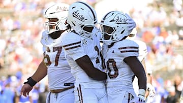 Sep 21, 2024; Starkville, Mississippi, USA; Mississippi State Bulldogs running back Johnnie Daniels (20) reacts with teammates after a touchdown against the Florida Gators during the fourth quarter at Davis Wade Stadium at Scott Field. Mandatory Credit: Matt Bush-Imagn Images