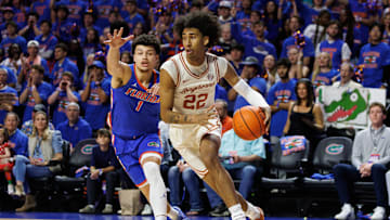 Jan 18, 2025; Gainesville, Florida, USA; Texas Longhorns forward Devon Pryor (22) drives to the basket away from Florida Gators guard Walter Clayton Jr. (1) during the first half at Exactech Arena at the Stephen C. O'Connell Center. Mandatory Credit: Matt Pendleton-Imagn Images