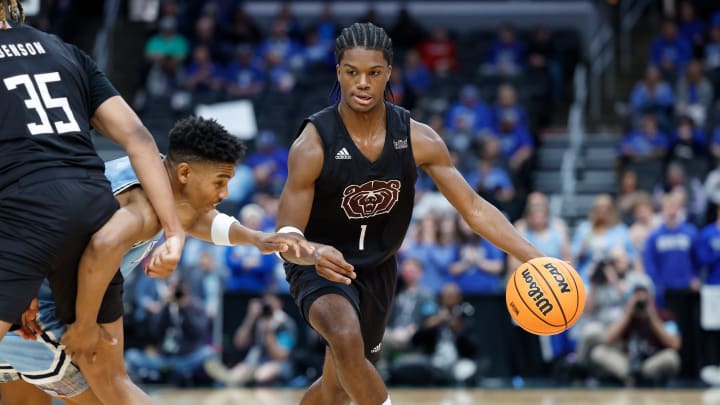 Missouri State junior Alston Mason (1) moves the ball during a Missouri Valley Conference Tournament game between Missouri State and Indiana State, Friday, March 8, 2024, at Enterprise Center in St. Louis.