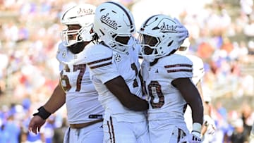 Sep 21, 2024; Starkville, Mississippi, USA; Mississippi State Bulldogs running back Johnnie Daniels (20) reacts with teammates after a touchdown against the Florida Gators during the fourth quarter at Davis Wade Stadium at Scott Field. Mandatory Credit: Matt Bush-Imagn Images