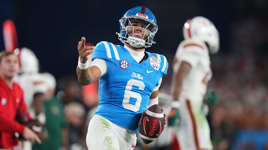 Ole Miss Rebels quarterback Trinidad Chambliss signals a first down after his run against the Miami Hurricanes.