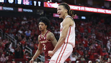 Florida State Seminoles guard Cam Miles looks on as Houston Cougars guard Kingston Flemings celebrates after scoring a basket during the first half at Toyota Center.