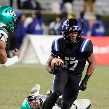 Ramsay   s Jayden Martin runs the ball and is pursued by Gulf Shores' Jamichael Garrett (7) during the 5A AHSAA State Championship Game in Bryant-Denny Stadium Thursday, Dec. 7, 2023.
