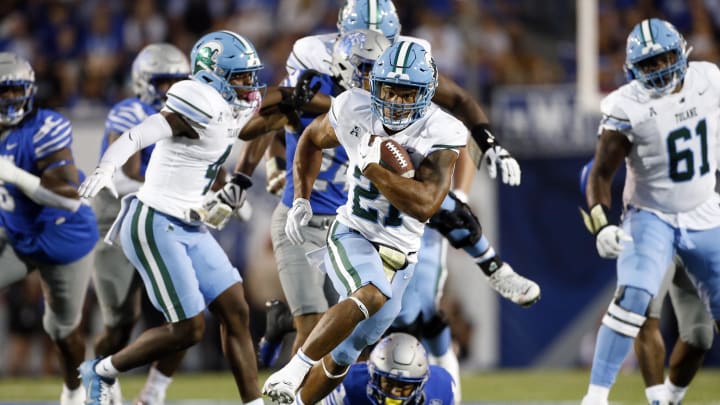 Oct 13, 2023; Memphis, Tennessee, USA; Tulane Green Wave running back Makhi Hughes (21) runs with the ball during the first half against the Memphis Tigers at Simmons Bank Liberty Stadium. Mandatory Credit: Petre Thomas-USA TODAY Sports