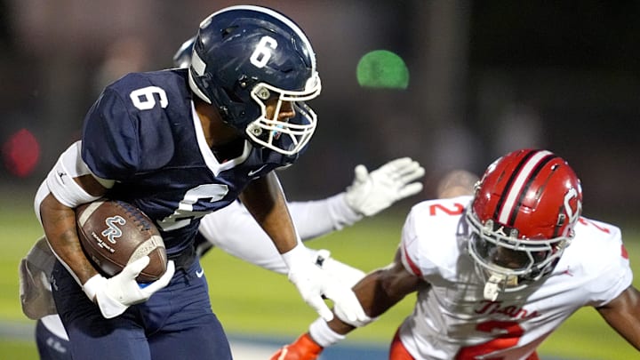 El Reno rushes the ball as Carl Albert defends during the high school football game between El Reno and Carl Albert in El Reno, Oklahoma, Thursday, Oct. 2, 2025.