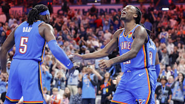 Apr 8, 2025; Oklahoma City, Oklahoma, USA; Oklahoma City Thunder guard Cason Wallace (22) celebrates with Oklahoma City Thunder guard Luguentz Dort (5) after scoring against the Los Angeles Lakers during the second half at Paycom Center. Mandatory Credit: Alonzo Adams-Imagn Images