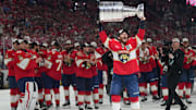 Jun 17, 2025; Sunrise, Florida, USA; Florida Panthers left wing Matthew Tkachuk (19) hoist the Stanley Cup after game six of the 2025 Stanley Cup Final against the Edmonton Oilers at Amerant Bank Arena. Mandatory Credit: Jim Rassol-Imagn Images