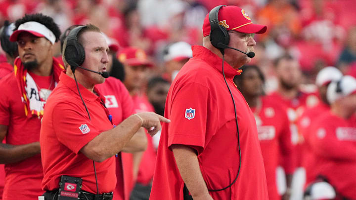 Aug 22, 2024; Kansas City, Missouri, USA; Kansas City Chiefs defensive coordinator Steve Spagnuolo, left and head coach Andy Reid watch play against the Chicago Bears during the game at GEHA Field at Arrowhead Stadium. Mandatory Credit: Denny Medley-Imagn Images
