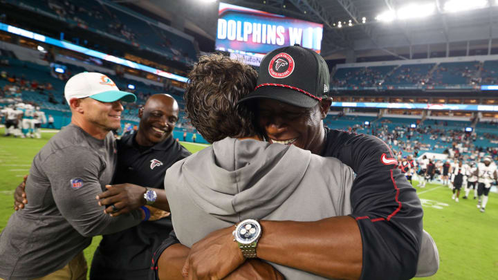 Atlanta Falcons head coach Raheem Morris greets Miami Dolphins head coach Mike McDaniel after the game on Friday night.