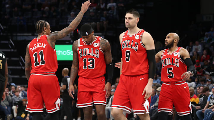 Feb 8, 2024; Memphis, Tennessee, USA; Chicago Bulls forward DeMar DeRozan (11) reacts with forward Torrey Craig (13), center Nikola Vucevic (9) and guard Jevon Carter (5) during a time out during the first half against the Memphis Grizzlies at FedExForum. Mandatory Credit: Petre Thomas-Imagn Images