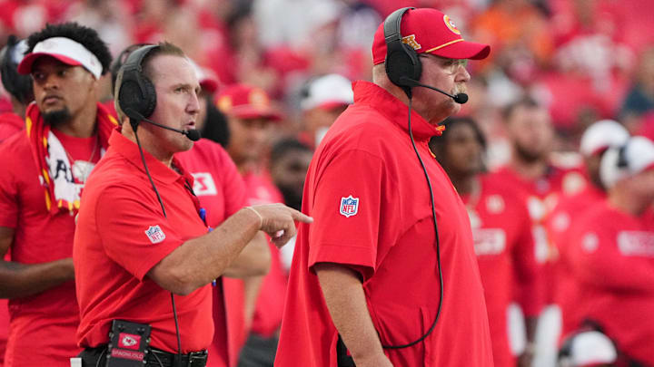 Aug 22, 2024; Kansas City, Missouri, USA; Kansas City Chiefs defensive coordinator Steve Spagnuolo, left and head coach Andy Reid watch play against the Chicago Bears during the game at GEHA Field at Arrowhead Stadium. Mandatory Credit: Denny Medley-Imagn Images