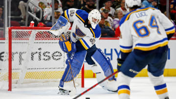 Sep 27, 2022; Chicago, Illinois, USA; St. Louis Blues goaltender Vadim Zherenko (60) passes the puck against the Chicago Blackhawks during the third period at United Center. Mandatory Credit: Jon Durr-USA TODAY Sports