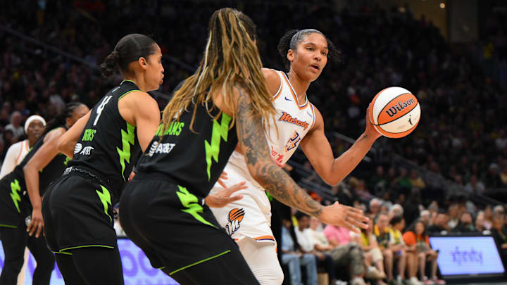 Aug 17, 2025; Seattle, Washington, USA; Phoenix Mercury forward Alyssa Thomas (25) passes the ball against the Seattle Storm during the first half at Climate Pledge Arena. Mandatory Credit: Steven Bisig-Imagn Images