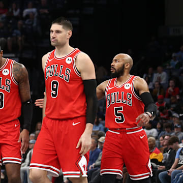 Chicago Bulls forward DeMar DeRozan (11) reacts with forward Torrey Craig (13), center Nikola Vucevic (9) and guard Jevon Carter (5) during a time out during the first half against the Memphis Grizzlies at FedExForum. Mandatory Credit: Petre Thomas-Imagn Images