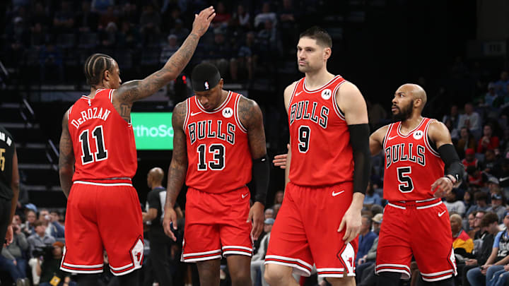 Chicago Bulls forward DeMar DeRozan (11) reacts with forward Torrey Craig (13), center Nikola Vucevic (9) and guard Jevon Carter (5) during a time out during the first half against the Memphis Grizzlies at FedExForum. Mandatory Credit: Petre Thomas-Imagn Images