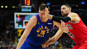 Nov 4, 2023; Denver, Colorado, USA; Denver Nuggets center Nikola Jokic (15) drives past Chicago Bulls center Nikola Vucevic (9) in the second half at Ball Arena.