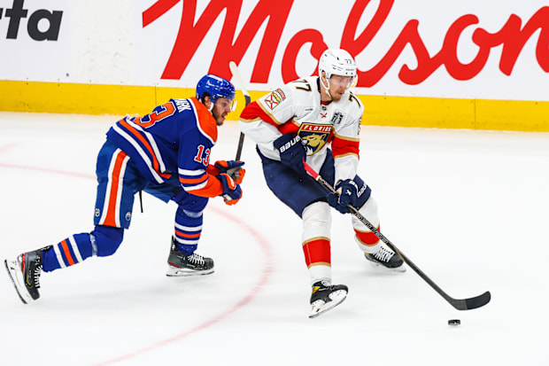 Hockey player shields the puc