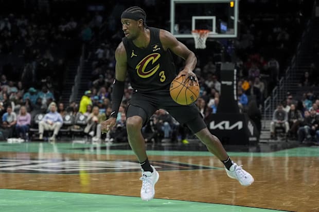 Caris LeVert dribbles the ball 